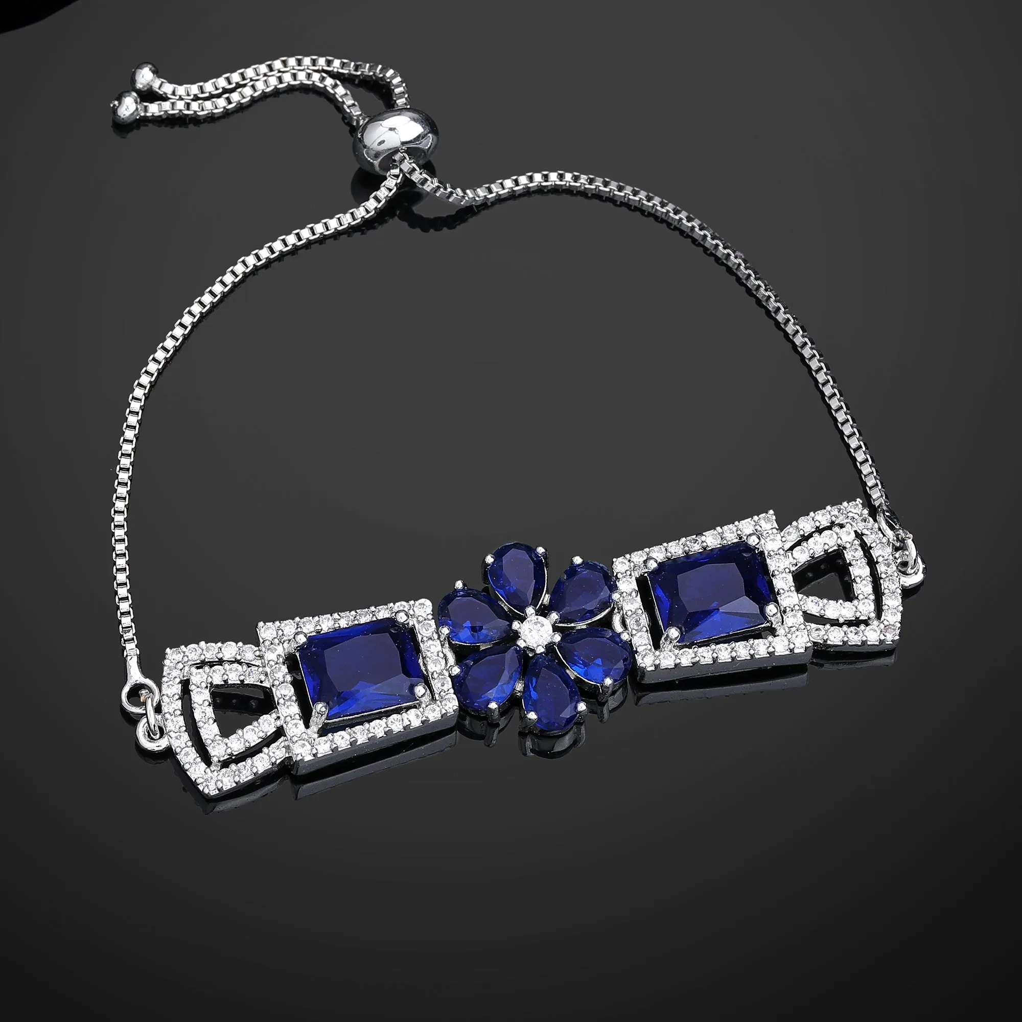 Estele Rhodium Plated Exquisite Floral Motif Enhanced Adjustable Charm Bracelet with Classic Blue American Diamonds for Women